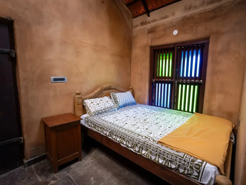 Neat Bedroom inside Mud House - Kilukka Farms