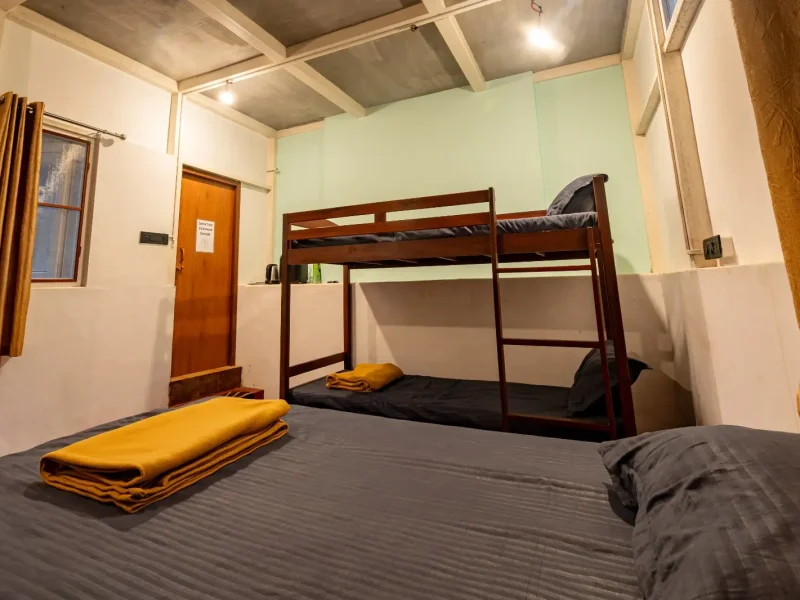 Double bed setup inside Mud House at Kilukka Farms