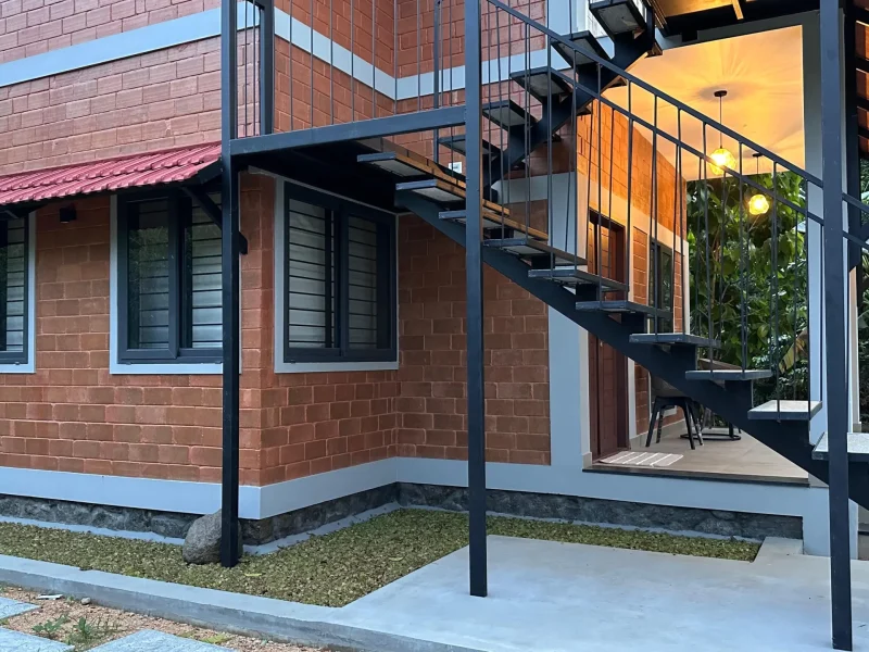 Outdoor area with open staircase in Macadamia cottage